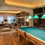 Pool table at the back of a home's living area