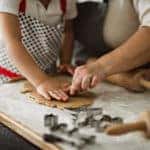 Family making Christmas ginger cookies