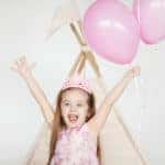 Little girl celebrating at her pink-themed birthday party