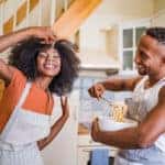 Couple cooking pasta together