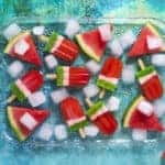 overhead view of watermelon kiwi pops in glass dish
