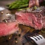 steak cut to show rare, red coloration