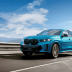2025 BMW X6 SUV cruising down the highway