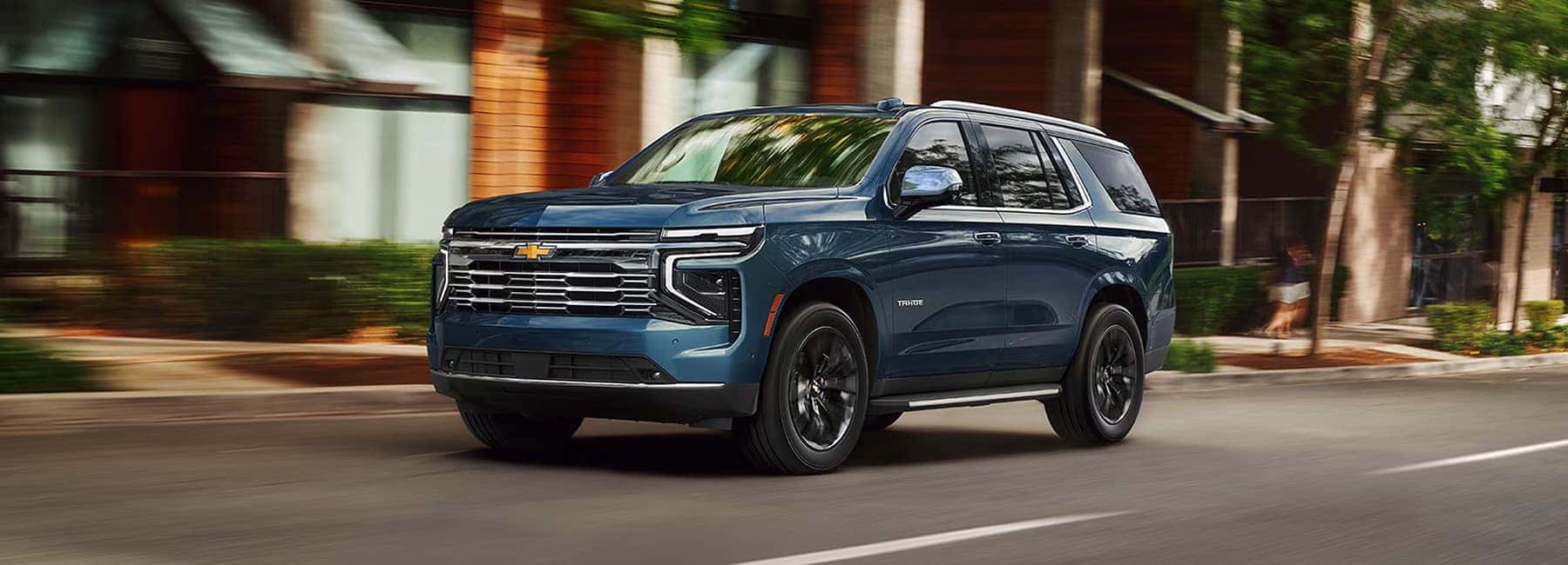 Cayenne Red 2022 GMC Terrain on a grassy road