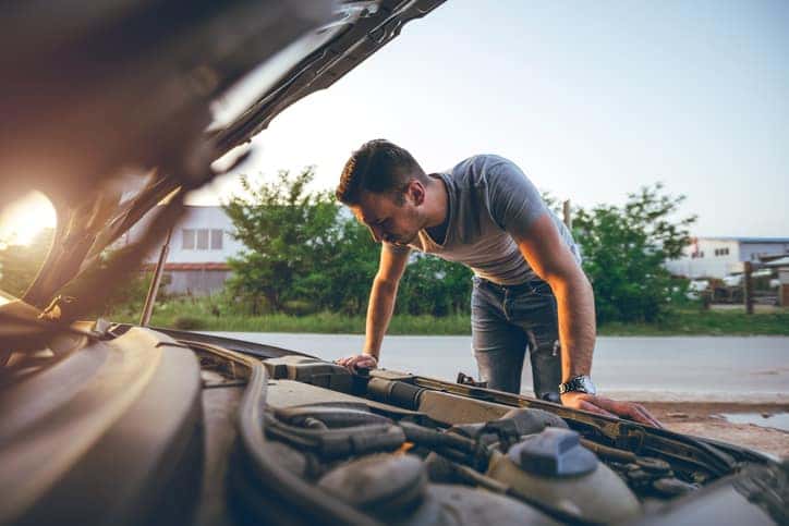 Beat the Heat: Keep Your Ride Cool and Running All Summer - Looking under car hood