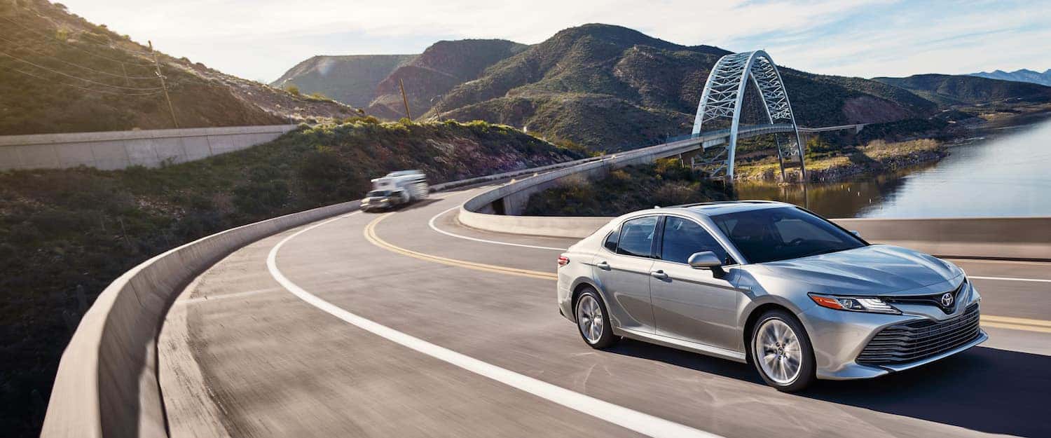 A Hybrid for Everyone at Boch Toyota | white 2019 toyota camry hybrid running on road A Hybrid for Everyone at Boch Toyota | white 2019 toyota camry hybrid running on road