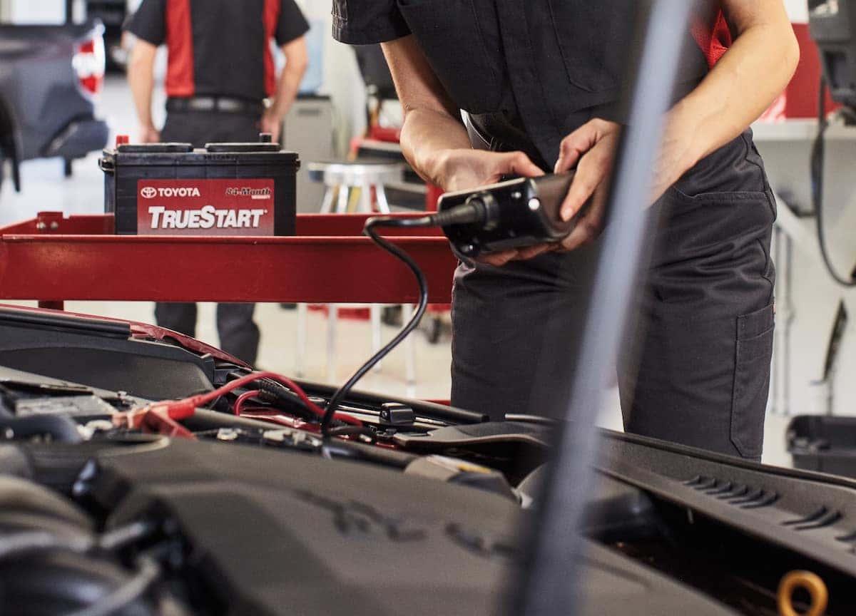 How to prepare your Toyota for the winter season | technician checking car battery How to prepare your Toyota for the winter season | technician checking car battery