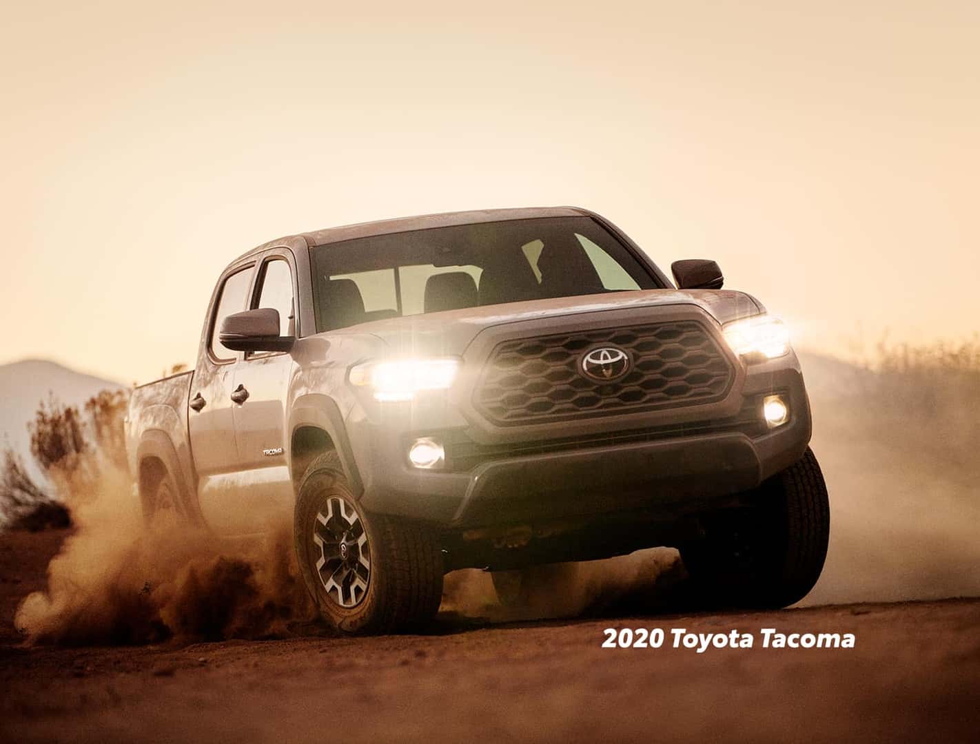 Comparison of the Toyota Tacoma vs. Tundra at Boch Toyota of Norwood | 2020 tacoma cover in dust