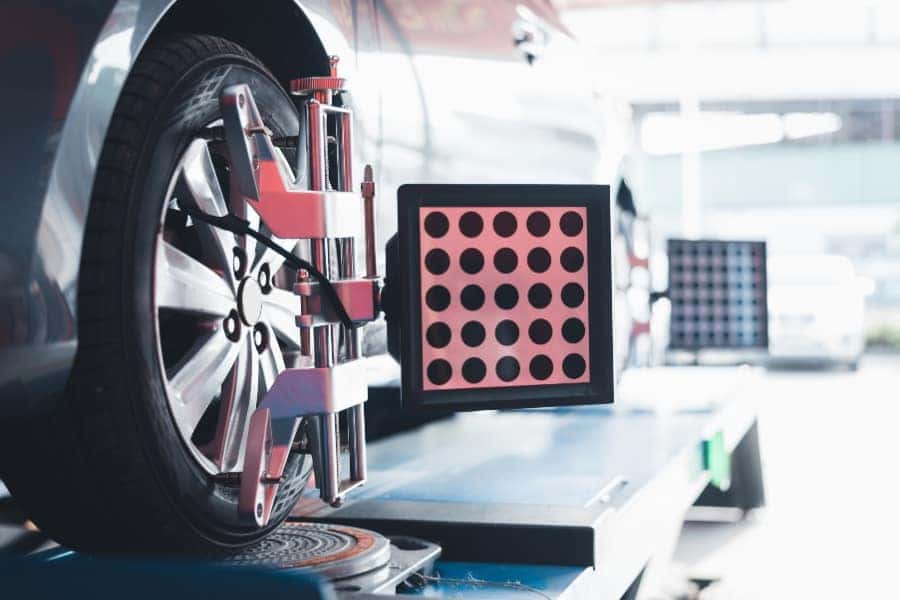 Wheel alignment on a lift.