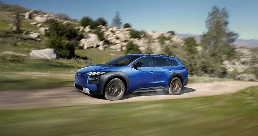 blue 2026 subaru trailseeker driving off-road