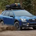 blue 2025 subaru outback off roading