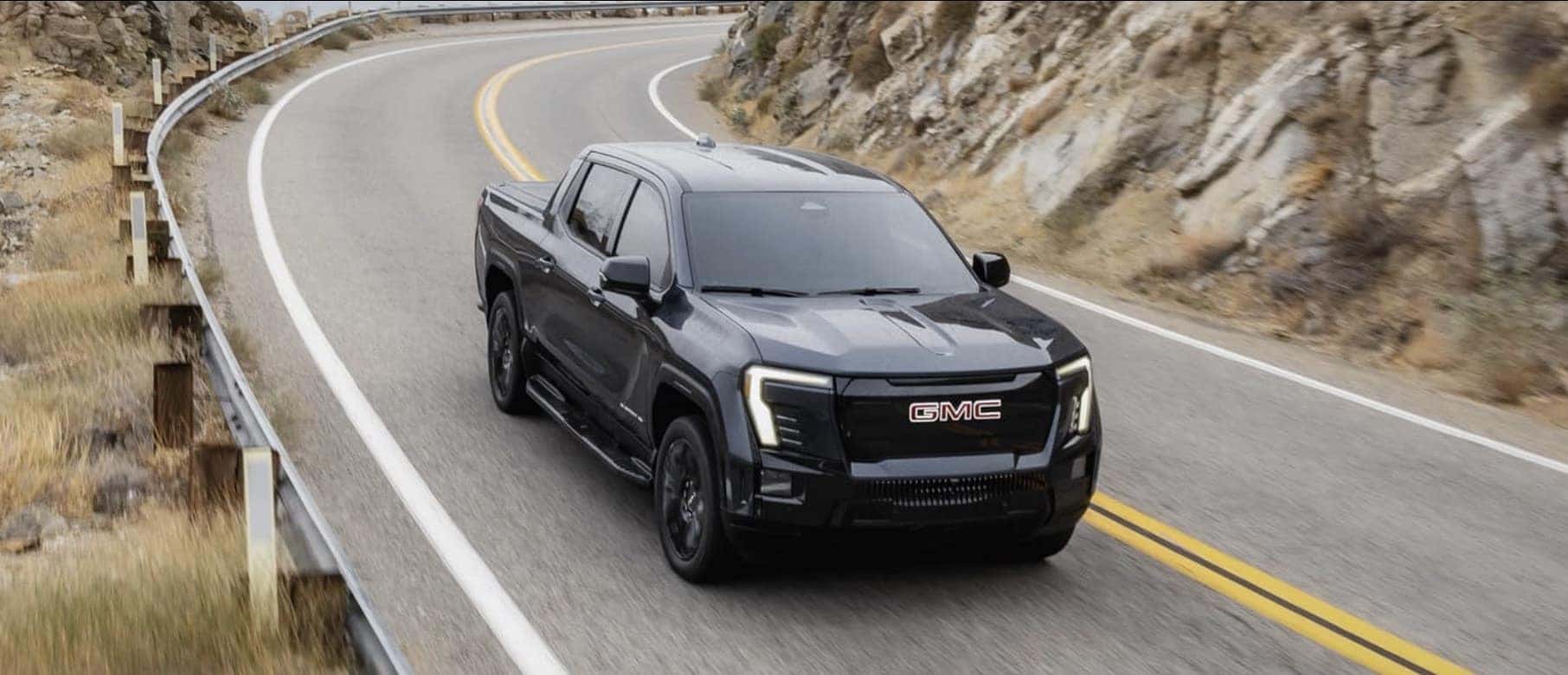 2026 GMC Sierra EV electric pickup on the road near Round Rock and Austin TX