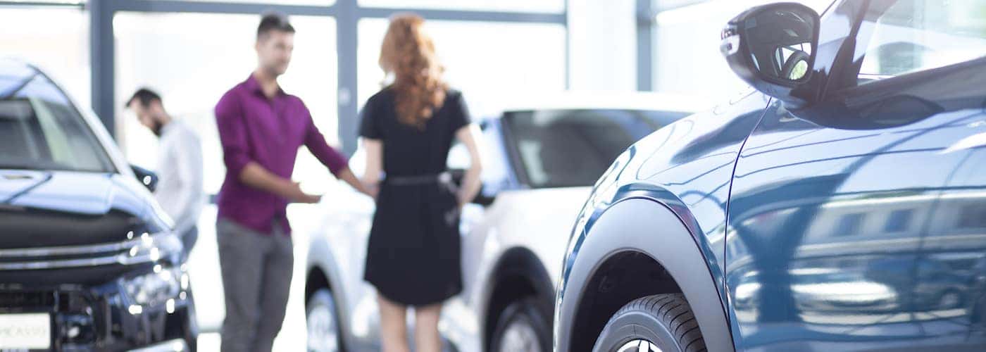 low angle of car and dealers