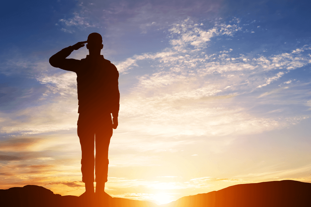 Military Serviceman with sunset in background
