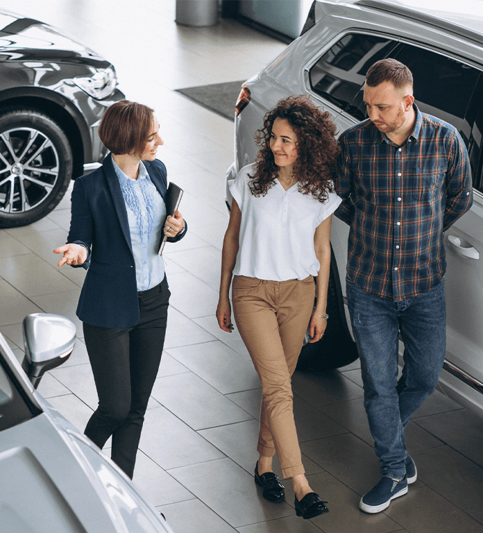 Toyota Dealer Near Clearfield | Sales person showing customers around the dealership
