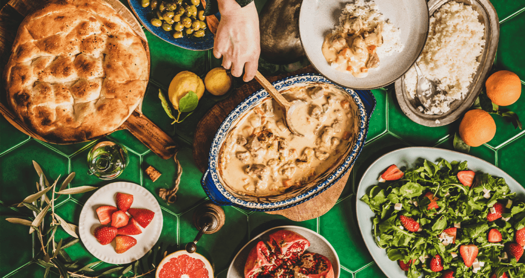 Toyota Dealer Near Philipsburg | Person serving food over a table of different dishes