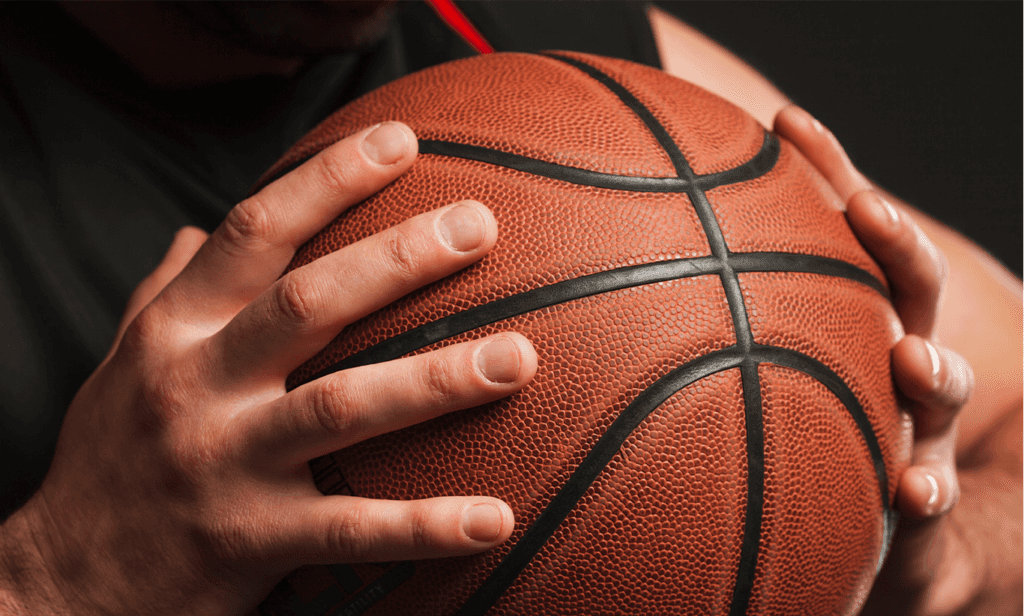 Toyota Dealer Near State College | Close up of basketball plater holding a basketball