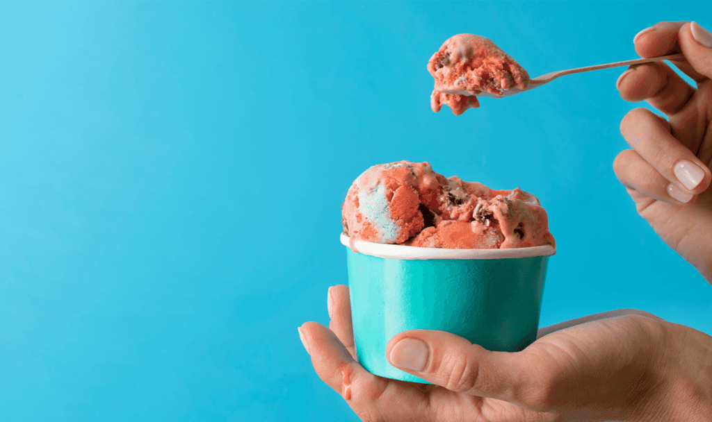 Toyota Dealer Near State College | Person scooping a scoop of pink ice cream