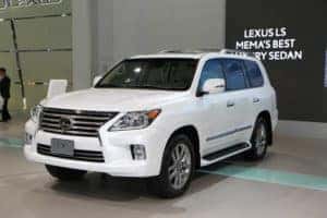 Front driver side view of white Lexus LX SUV.