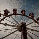 Looking up at the top of a ferris wheel