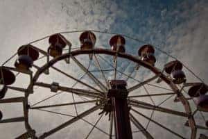 Looking up at the top of a ferris wheel