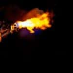 person holding grey lit torch