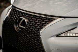 Front grill of white Lexus car.