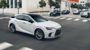 2023 Lexus RX driving down the street