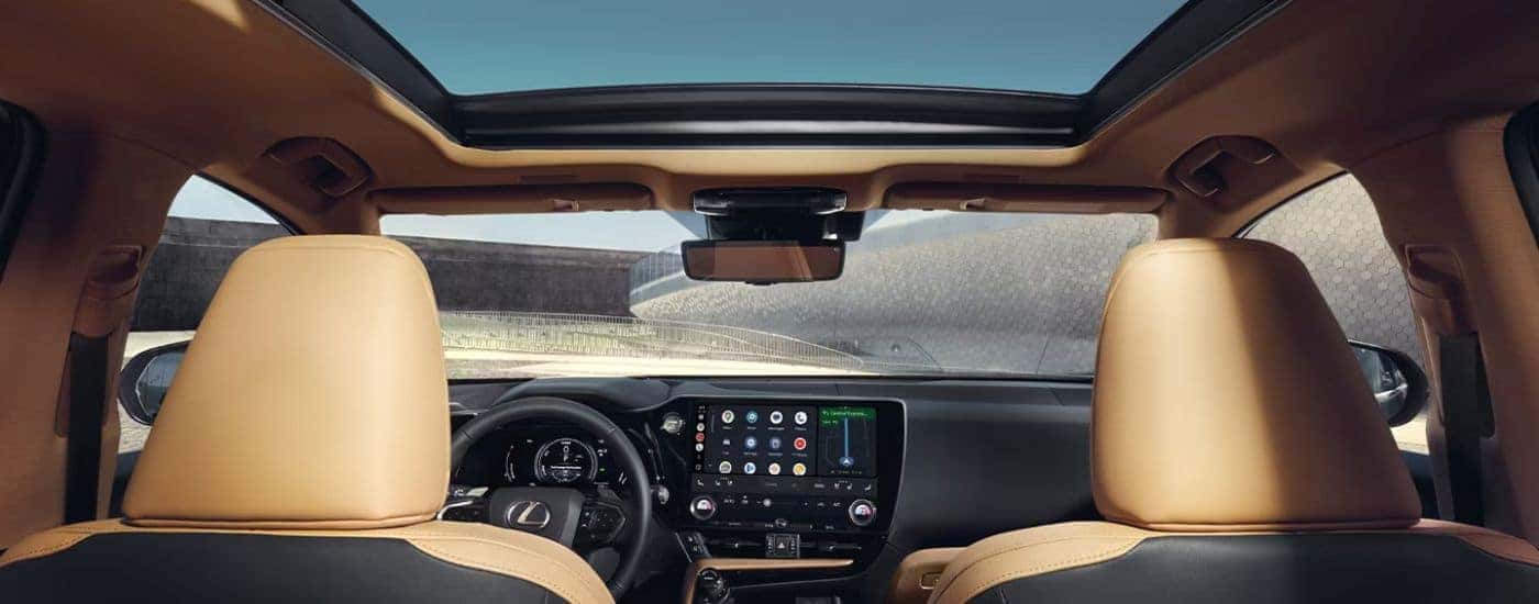 Black and tan interior of a 2026 Lexus NX 450h+ Luxury.