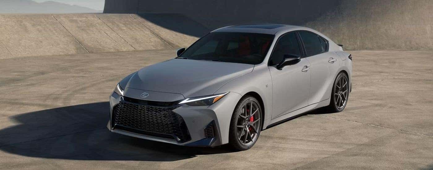 A silver 2026 Lexus IS 350 F Sport parked on concrete.