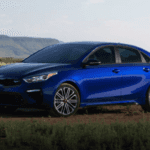 2020 kia forte blue exterior parked in field
