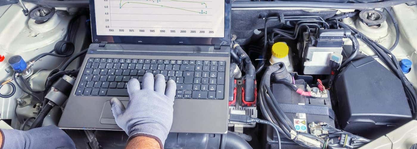 mechanic checking transmission diagnostics