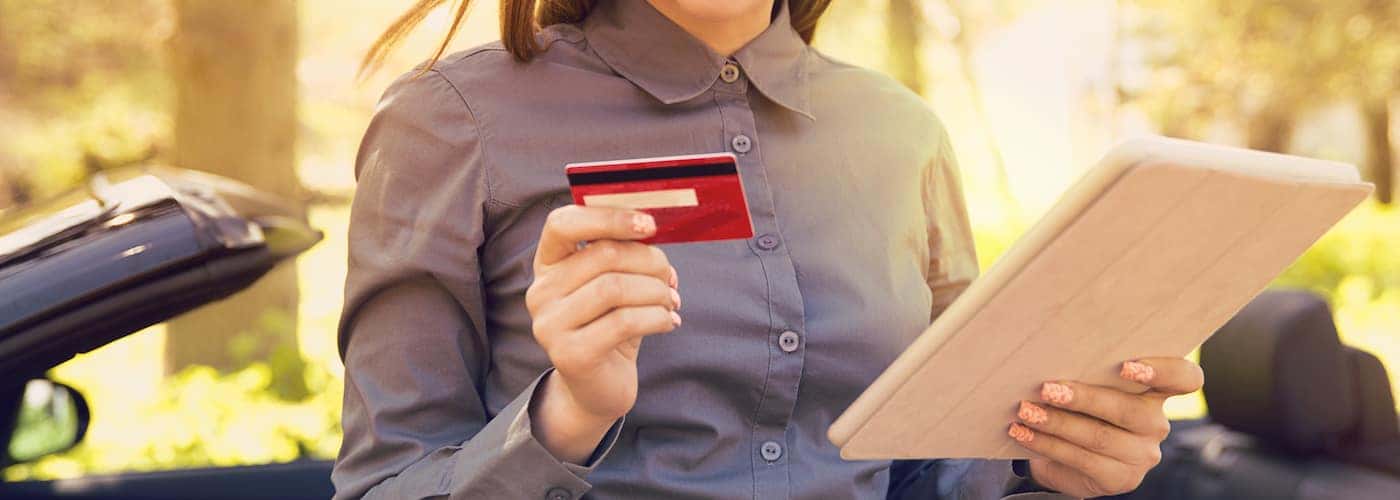 woman checking credit card 
