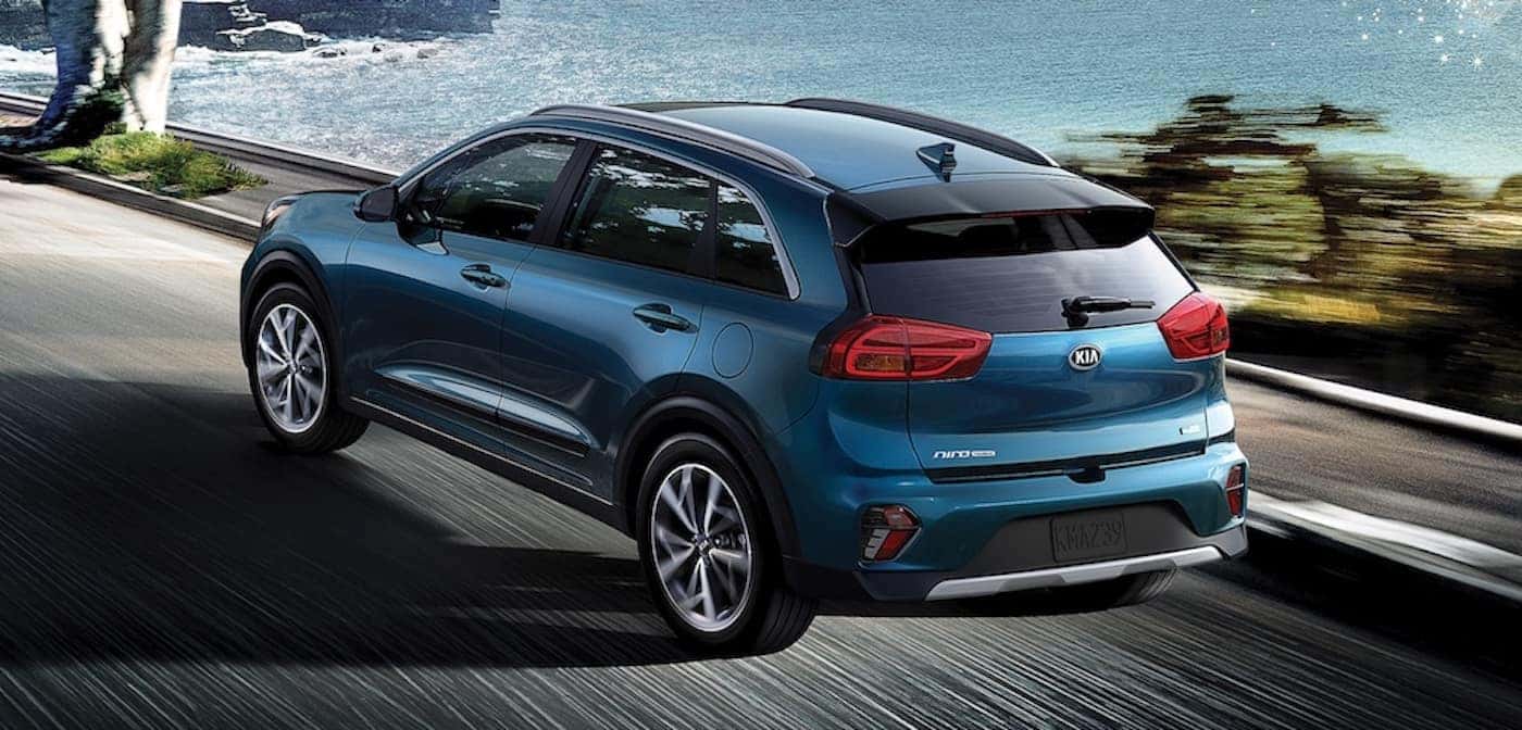 2021 kia niro blue exterior driving down road