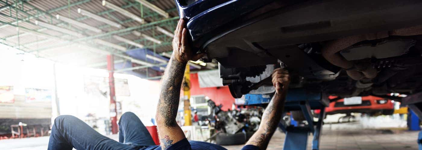 mechanic working on repairing brakes