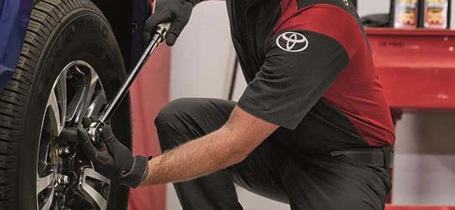 mechanic working on tire