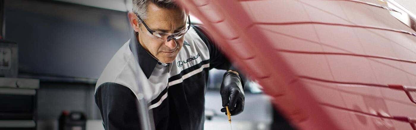 Lexus Service Mechanic Checking Oil