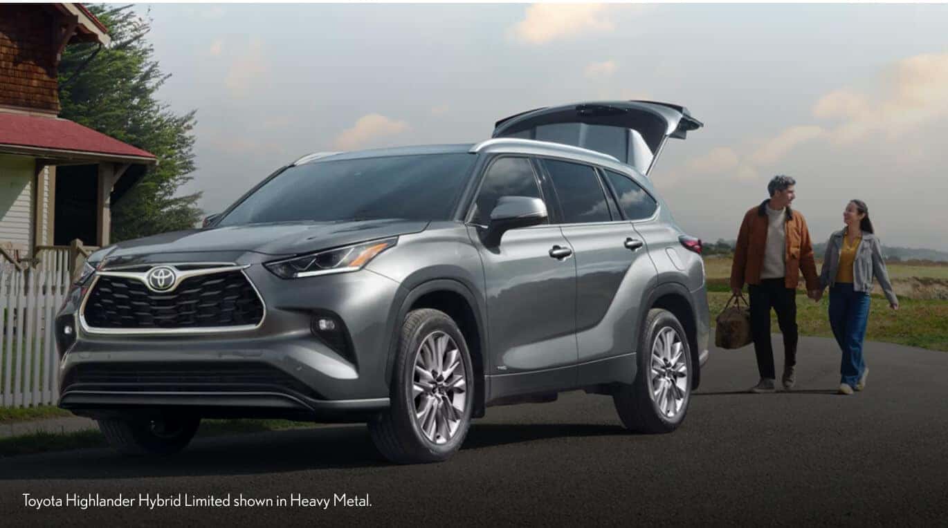 Low-angle view of Toyota Highlander Hybrid Limited in Heavy Metal with an open liftgate.