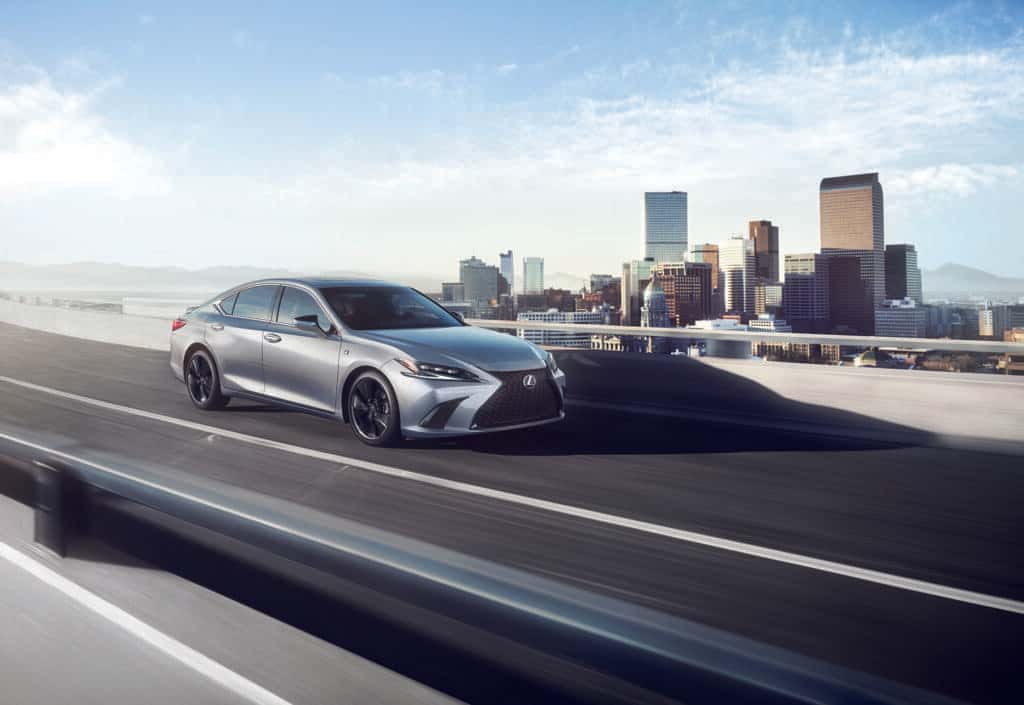 Lexus ES350 Driving in Front of a City Skyline