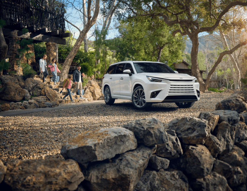 Lexus TX Parked in Front of a Cabin