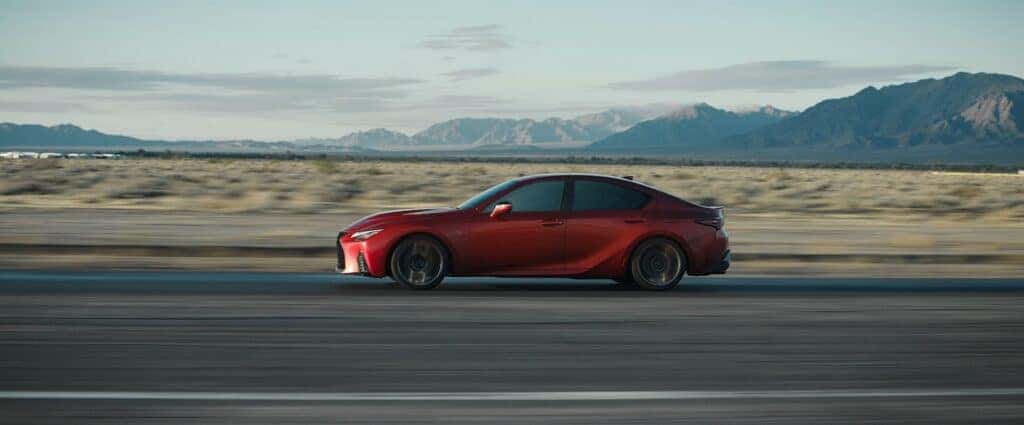 2024 Lexus IS 500 F Sport on a road way in the dessert