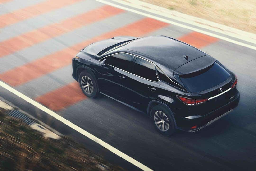 Black 2021 Lexus RX 350 driving down the highway