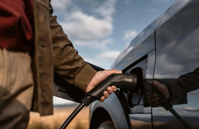 Man Charging 2023 Lexus RZ BEV