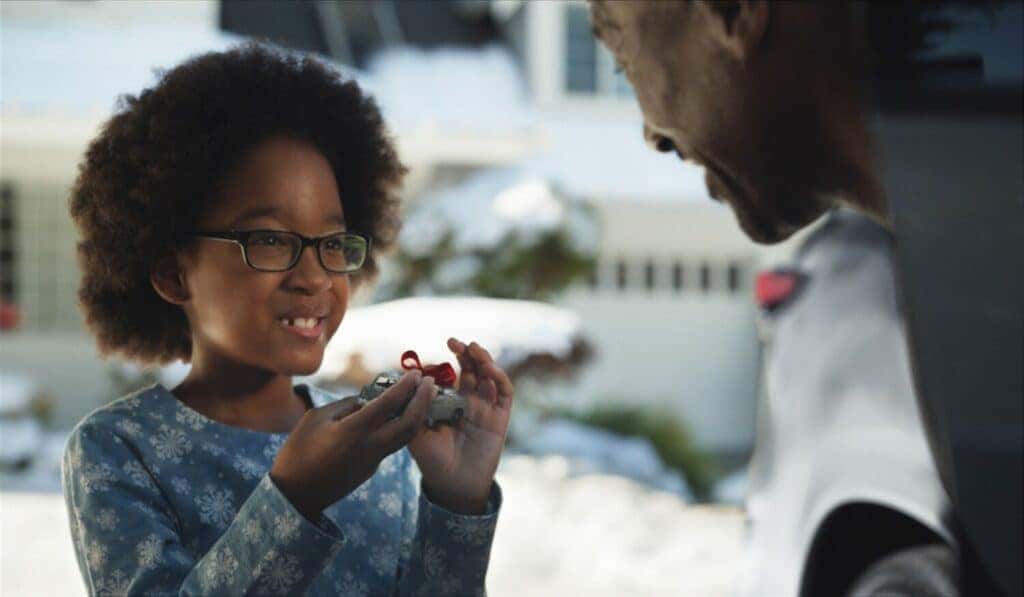 Boy Smiling with a Toy Car in Overnight Lexus Advertisement