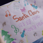 pink envelope addressed to santa clause