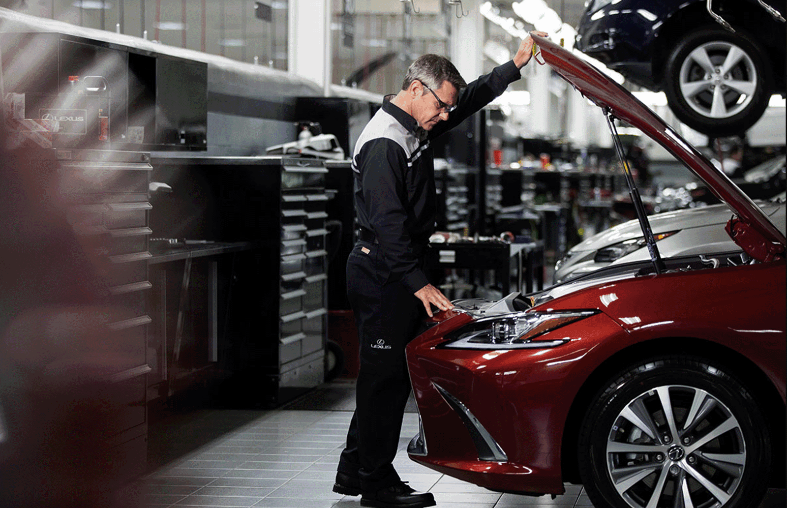 red Lexus being serviced