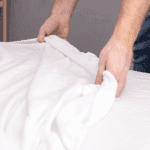 man making the bed