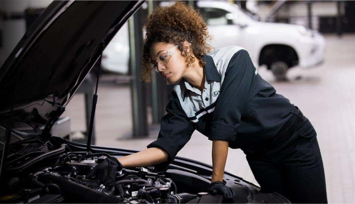 Tech working on vehicle