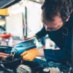 Auto Mechanic working on car