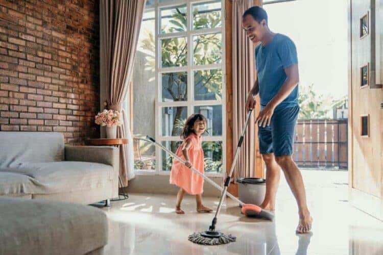 Make Spring Cleaning A Breeze - little girl help her daddy to with spring cleaning at home